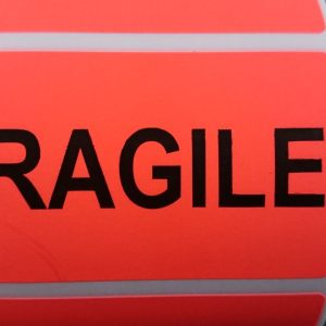 Fluro Red 70mm x 40mm with FRAGILE in black, 38mm core, 1 across Label, 1,000per roll